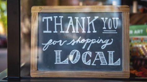 A sign that reads, "Thank you for shopping local."