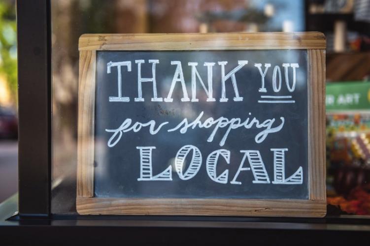 A sign that reads, "Thank you for shopping local."