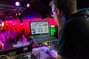 A DJ playing at one of many Denver bars with live music