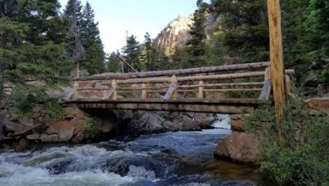 A river and bridge in Rocky Mountain National Park, one of the best national parks in Colorado