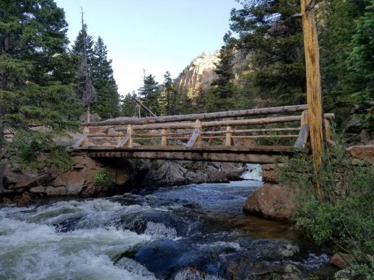 A river and bridge in Rocky Mountain National Park, one of the best national parks in Colorado