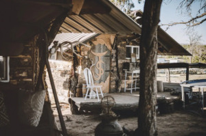 Exterior view of an all-wood rustic cabin, one of many unique places to stay in Colorado