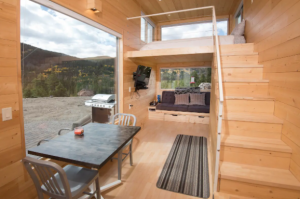 The kitchen and dining area of a tiny home that is one of the most unique places to stay in Colorado