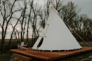 A teepee on an elevated deck, one of many unique places to stay in Colorado