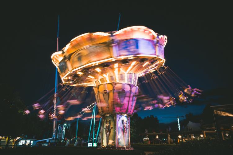 A ride lit up and spinning in Elitch Gardens, one of the bigger theme parks in Colorado