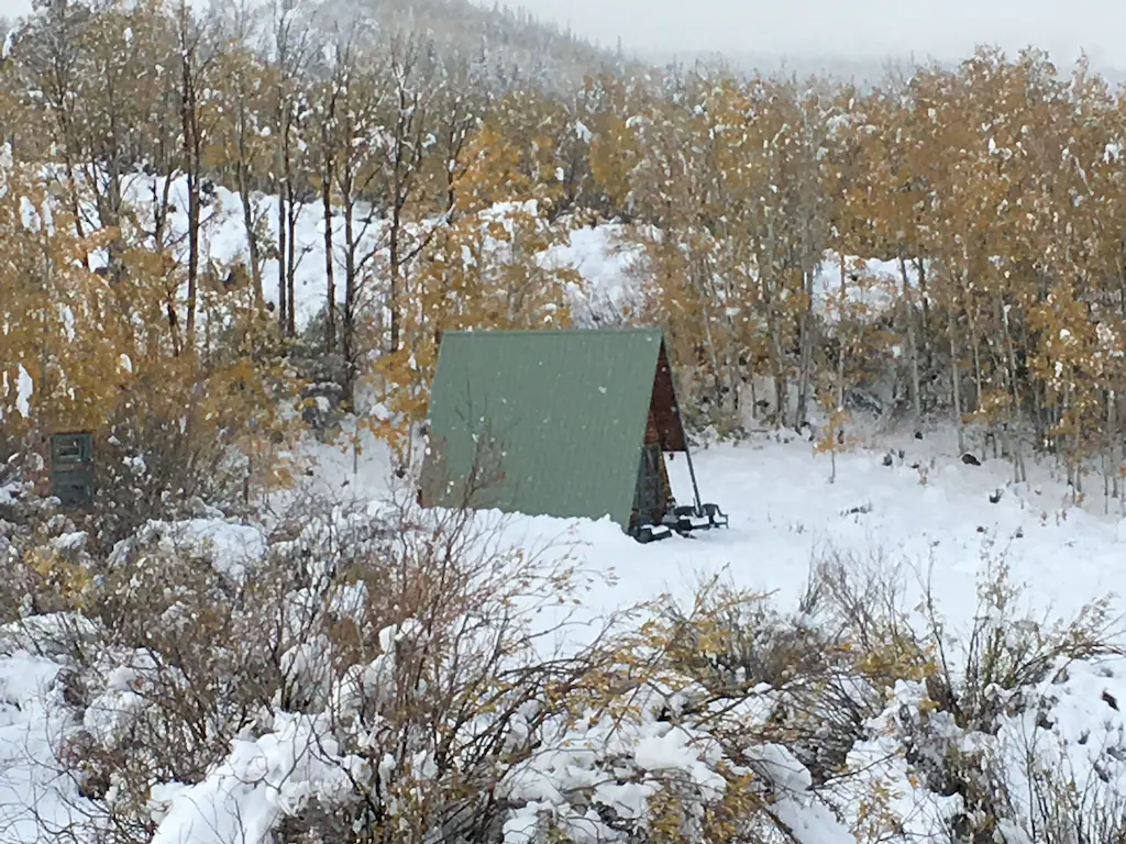 A secluded a-frame cabin in the snow